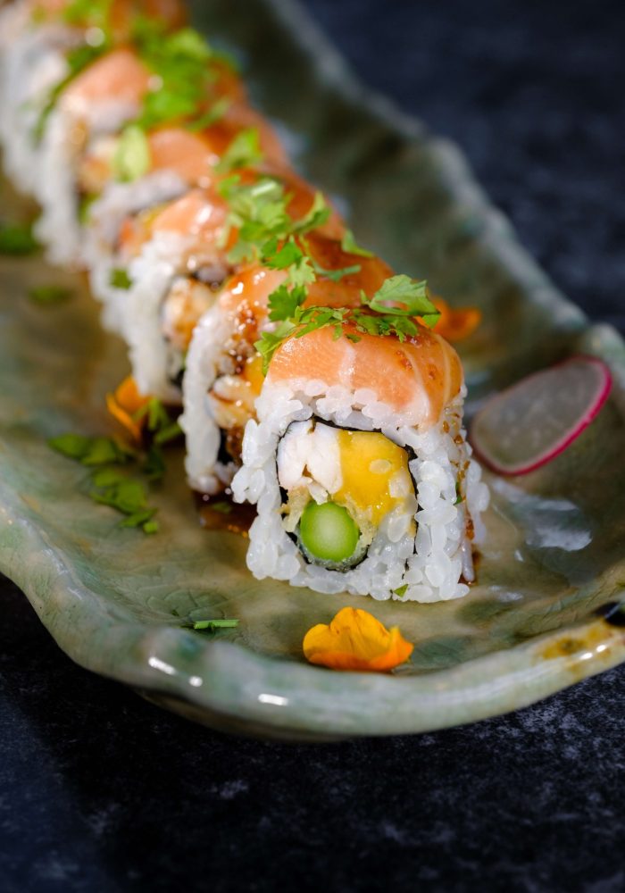 high-angle-tasty-sushi-with-vegetable-fresh-fish-served-with-pear-traditional-marble-plate-black-table-restaurant high-angle-tasty-sushi-with-vegetable-fresh-fish-served-with-pear-traditional-marble-plate-black-table-restaurant